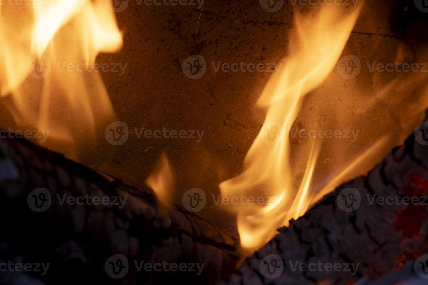 A burning flame with charcoals in the stove photo