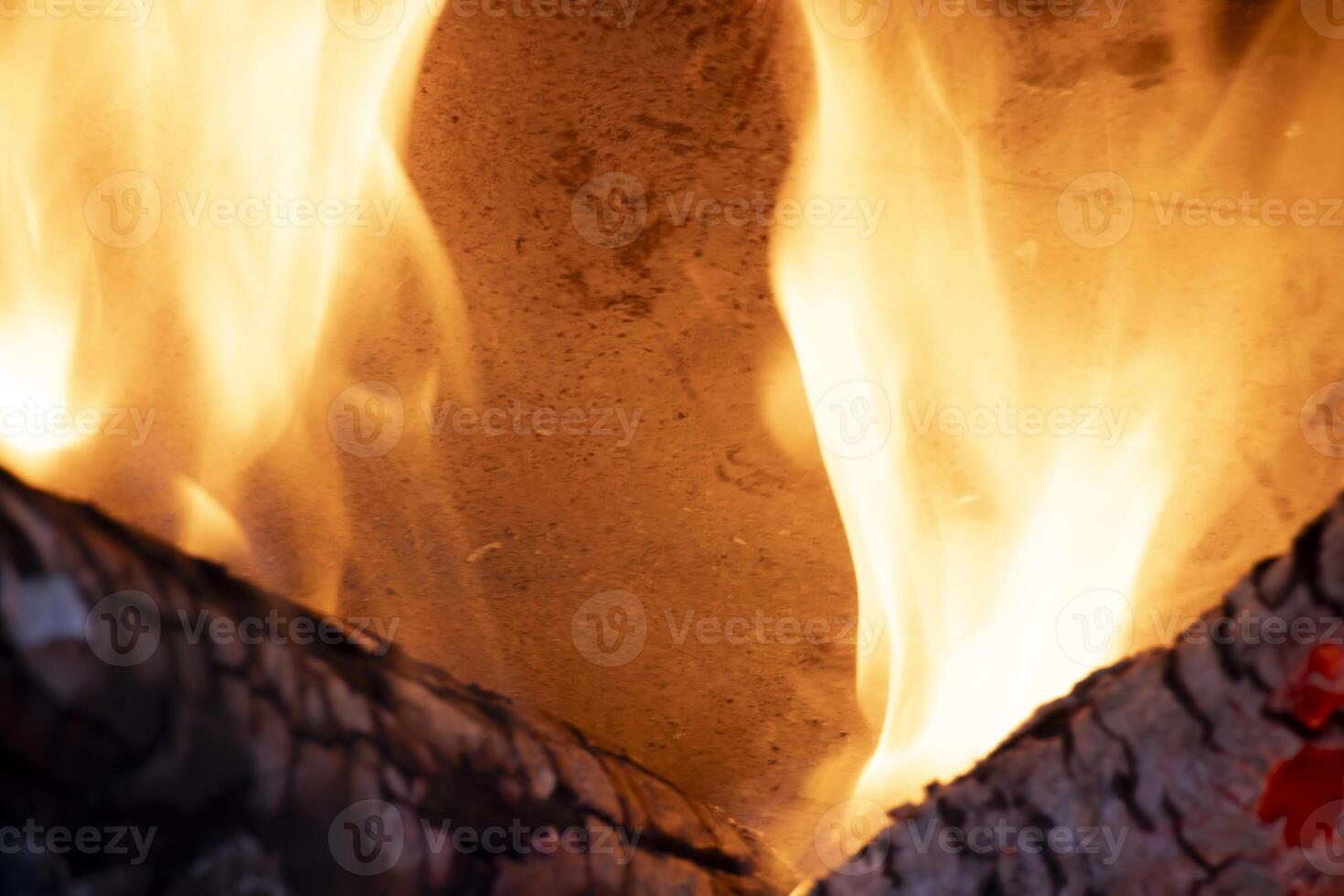 A burning flame with charcoals in the stove photo