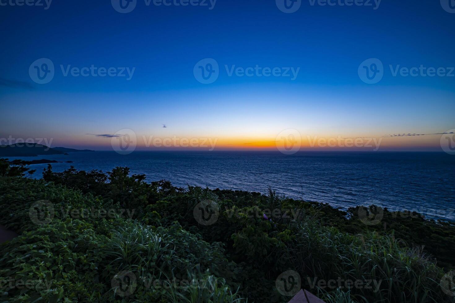 Sunset at the panoramic ocean at Mineyama promontory in Amami oshima Kagoshima photo