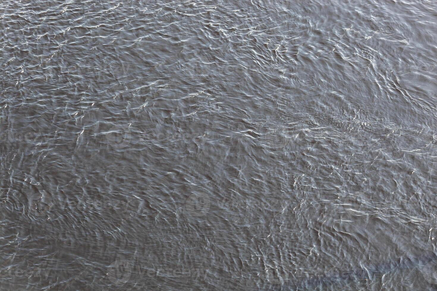 Water texture with ripples on the surface photo