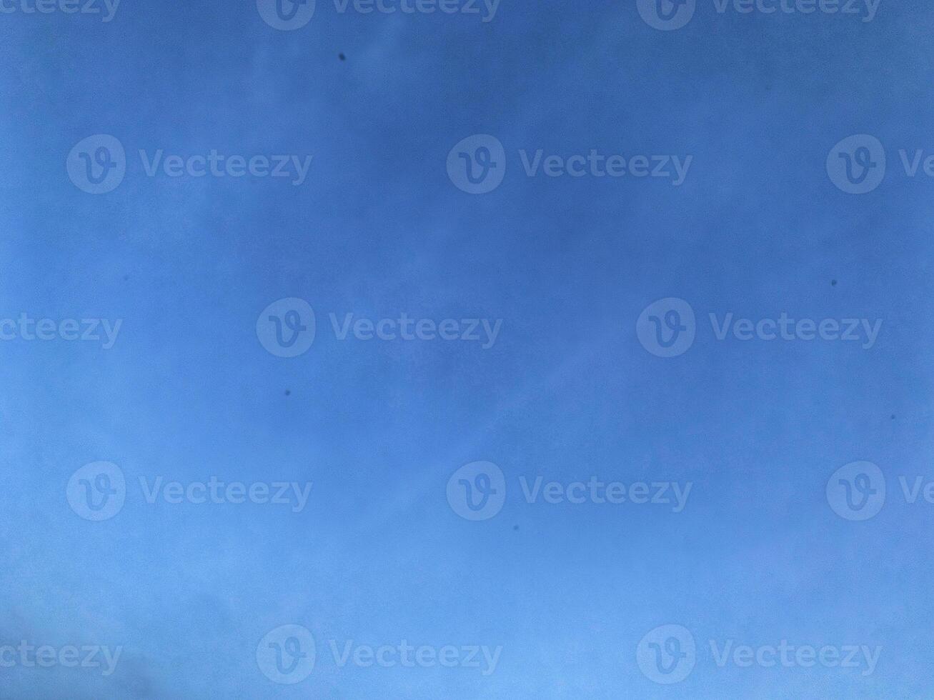 A view of a bright blue sky with white clouds, for background photo
