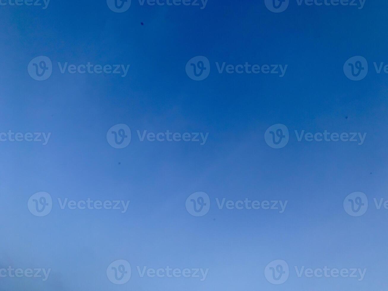 A view of a bright blue sky with white clouds, suitable for the background photo