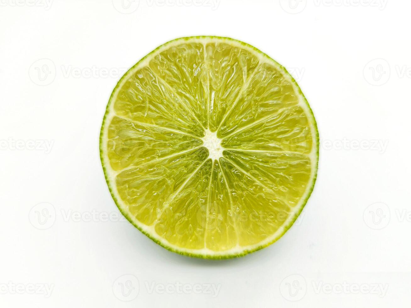Top View of a Fresh Lime Slice on White Background photo