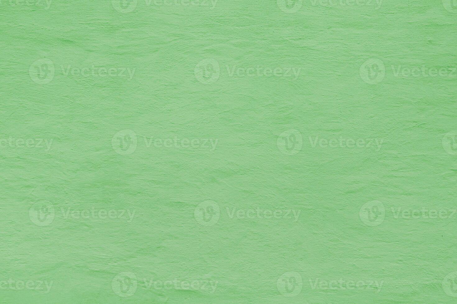 Green plastered old wall. Abstract construction background photo