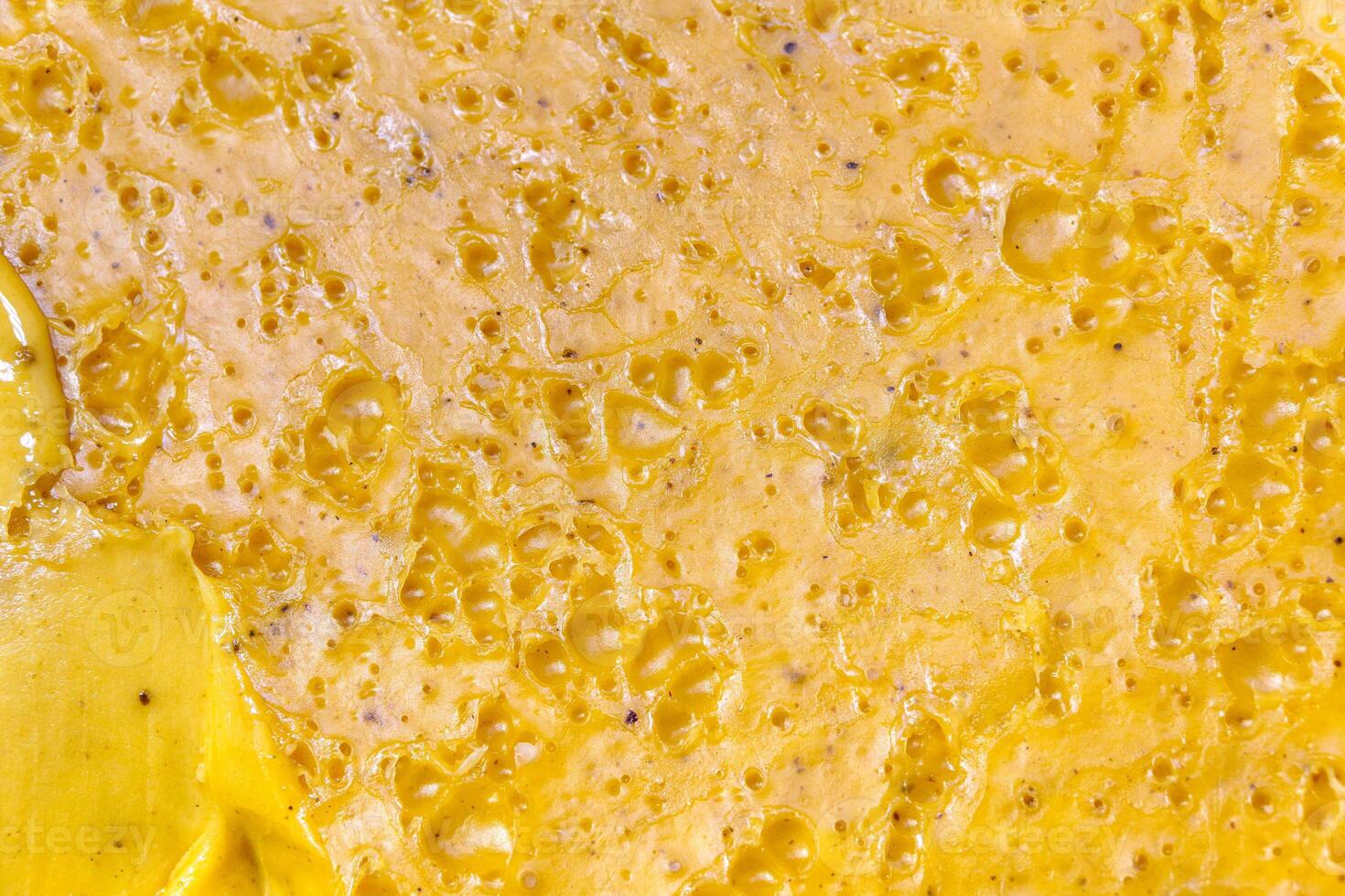 xture of honey with yellow iller. photo