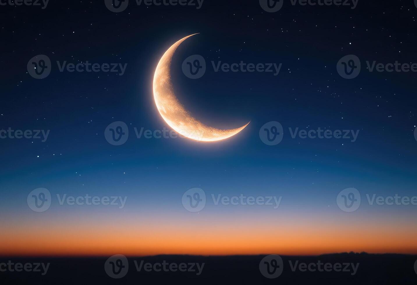 A glowing crescent moon with twinkling stars in the night sky photo