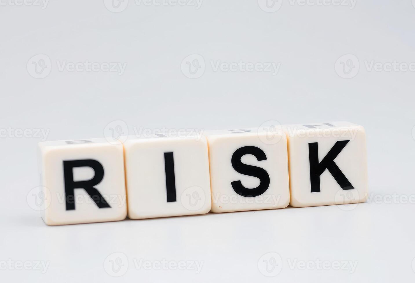 risk word block on white background photo