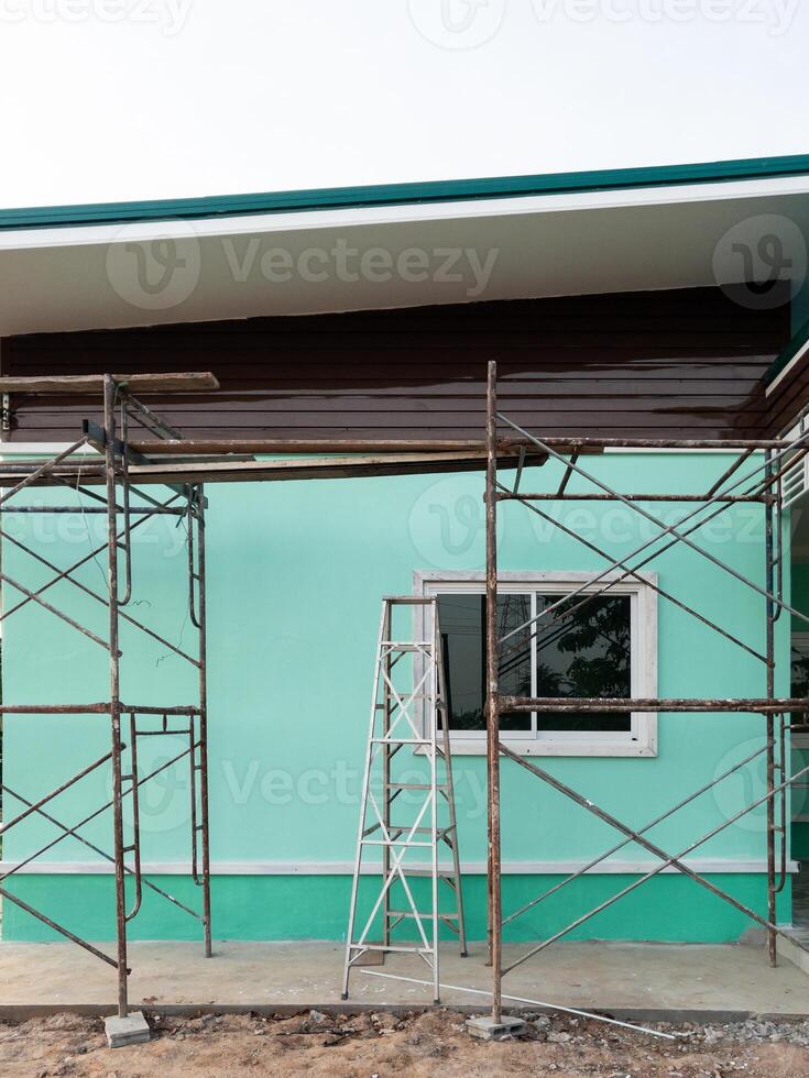 Scaffolding and Ladder at an Unfinished House. photo