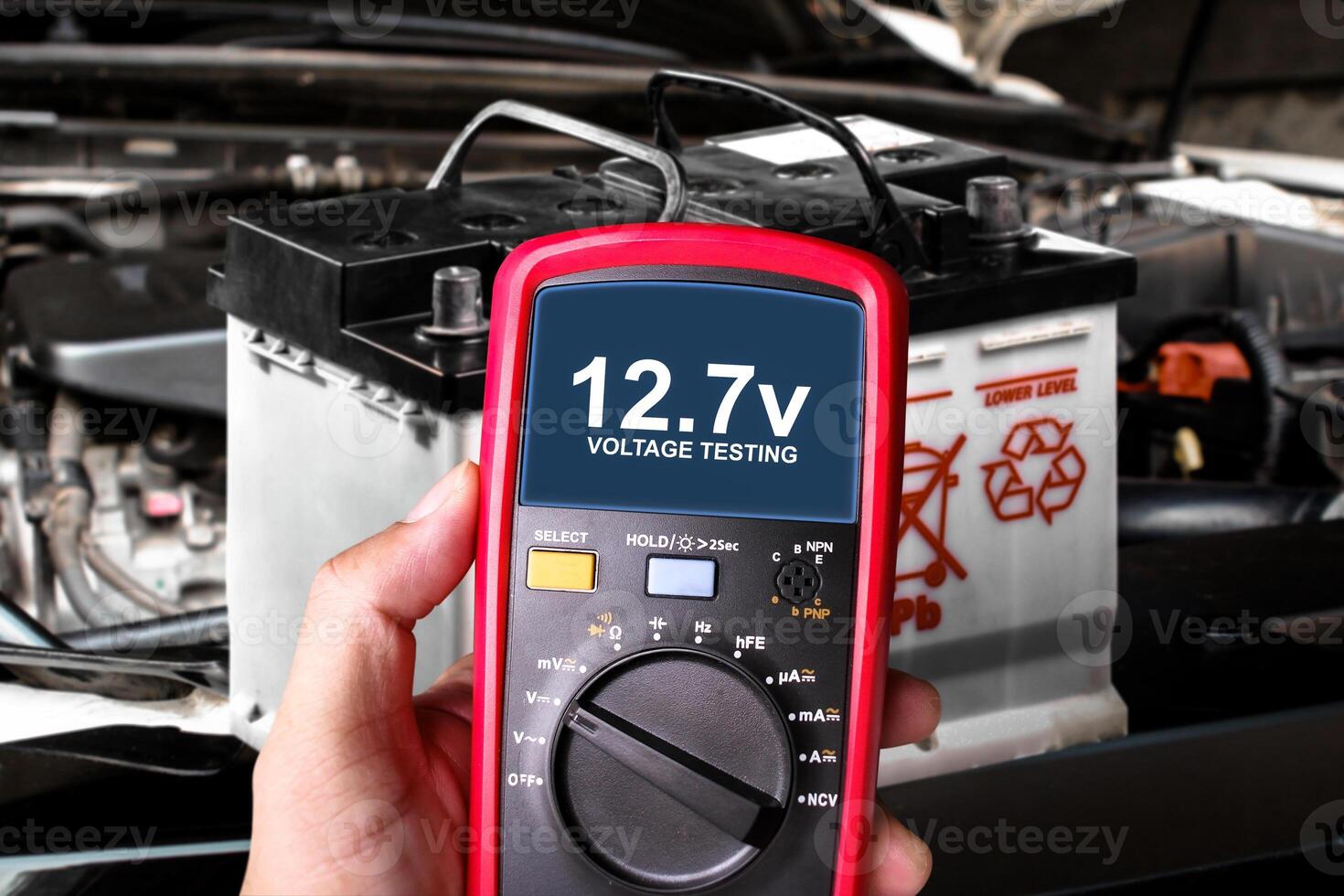 Voltage testing with multimeter on car battery , Car maintenance concept photo