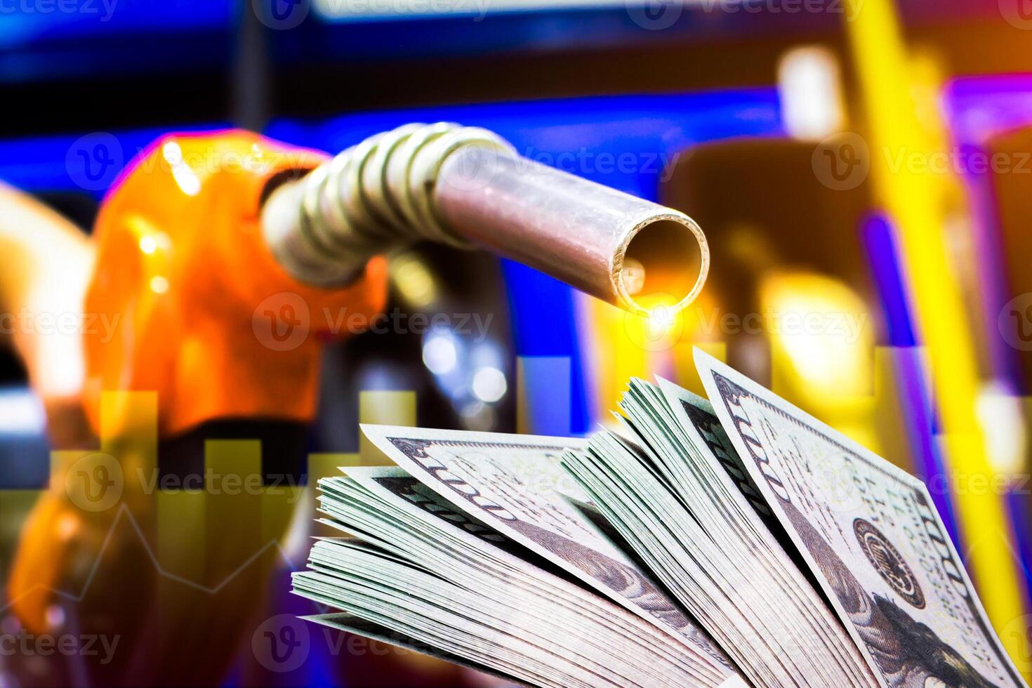 Fuel pump with cash and economic charts , oil and energy business concept photo