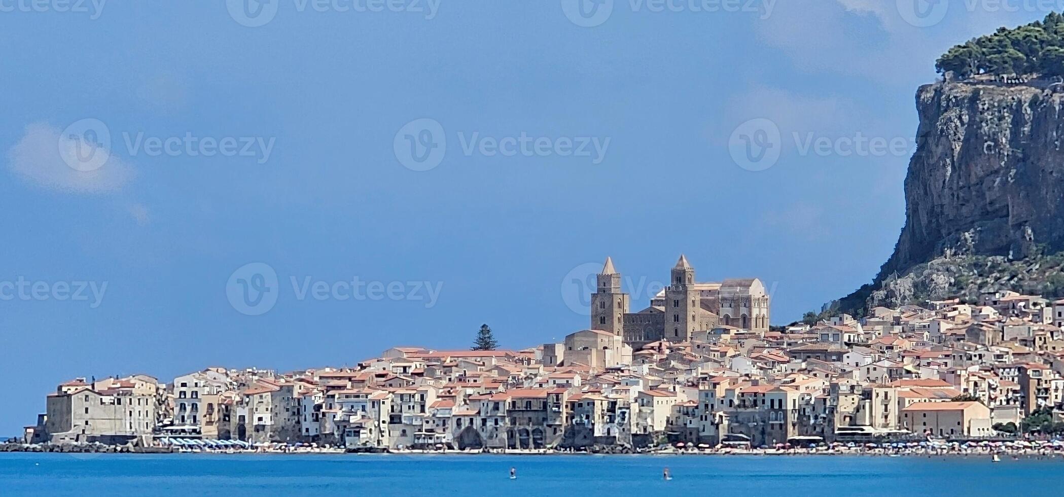 landscape of cefalu, sicily and its sandy beaches with crystal clear sea in the summer of 2024 on holiday photo