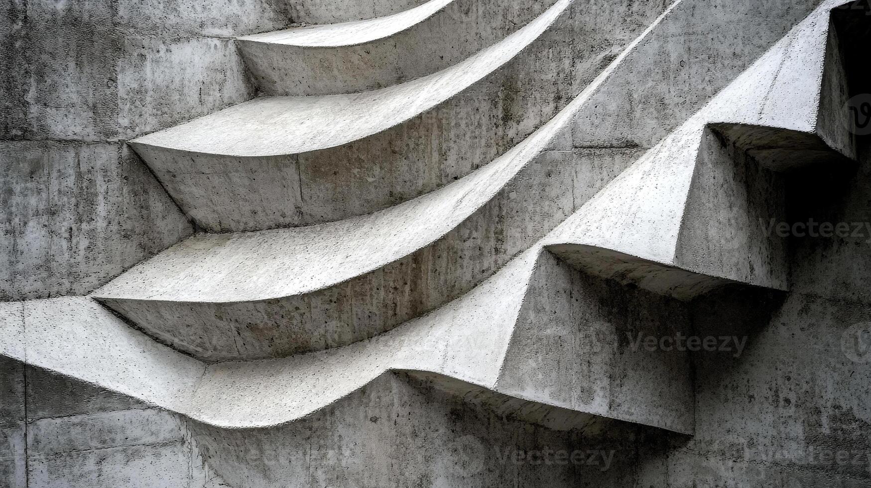 Intricate patterns emerge from the textured concrete surface, creating a visually engaging composition of curves and lines. The abstract design invites closer examination of its details and depth photo
