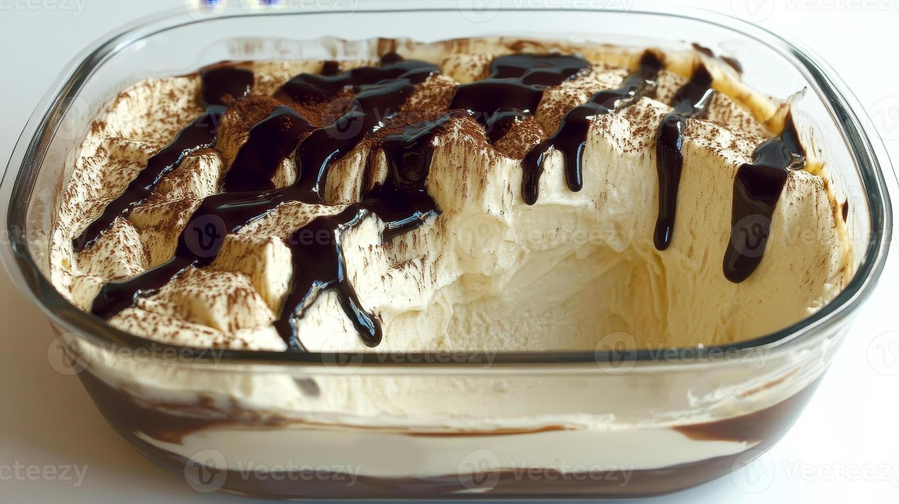 A luscious dessert of bavarian cream elegantly layered with silky chocolate sauce, topped with a touch of cocoa, perfect for satisfying sweet cravings at any gathering photo