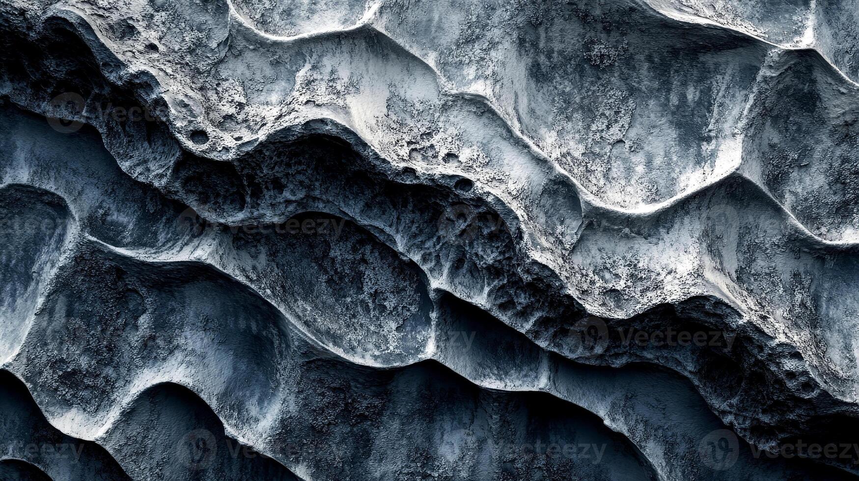 Intricate patterns of textured concrete create an abstract and visually engaging backdrop. The blend of tones and surfaces offers depth, emphasizing the organic shapes within the material photo