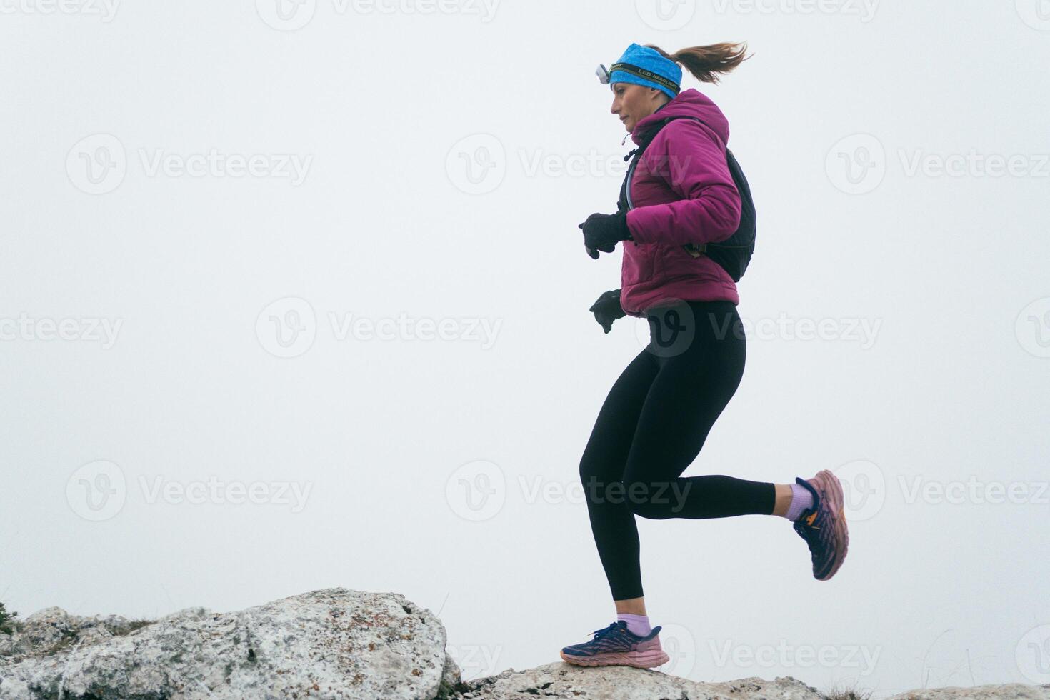 Trail Runner in Misty Mountain Landscape photo