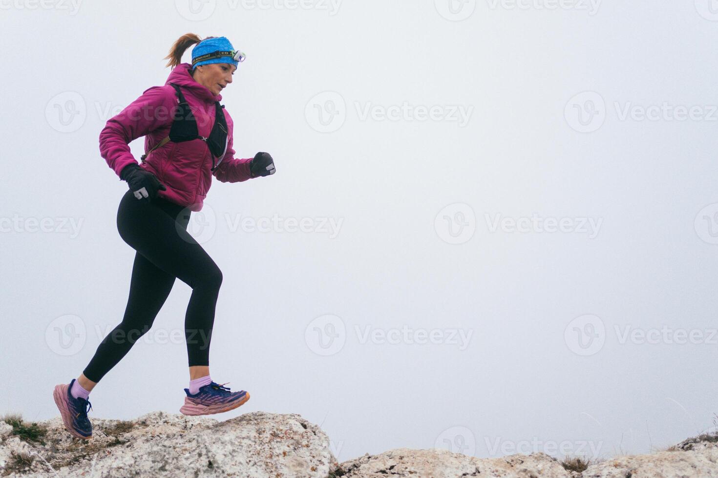 Trail Runner in Misty Mountain Landscape photo
