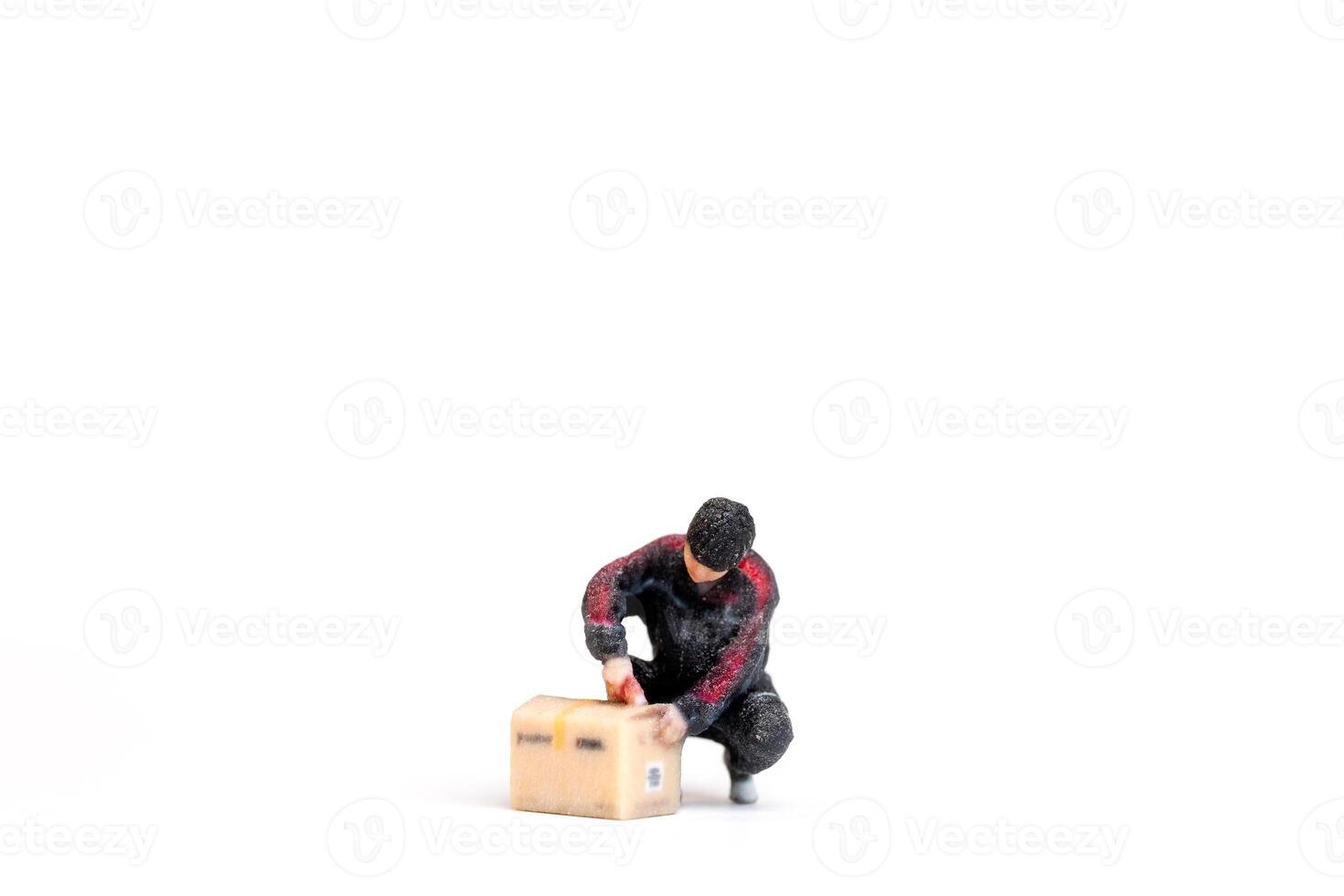 A Miniature figurine of a delivery worker carrying packages Concept of service and reliability in a creative photo