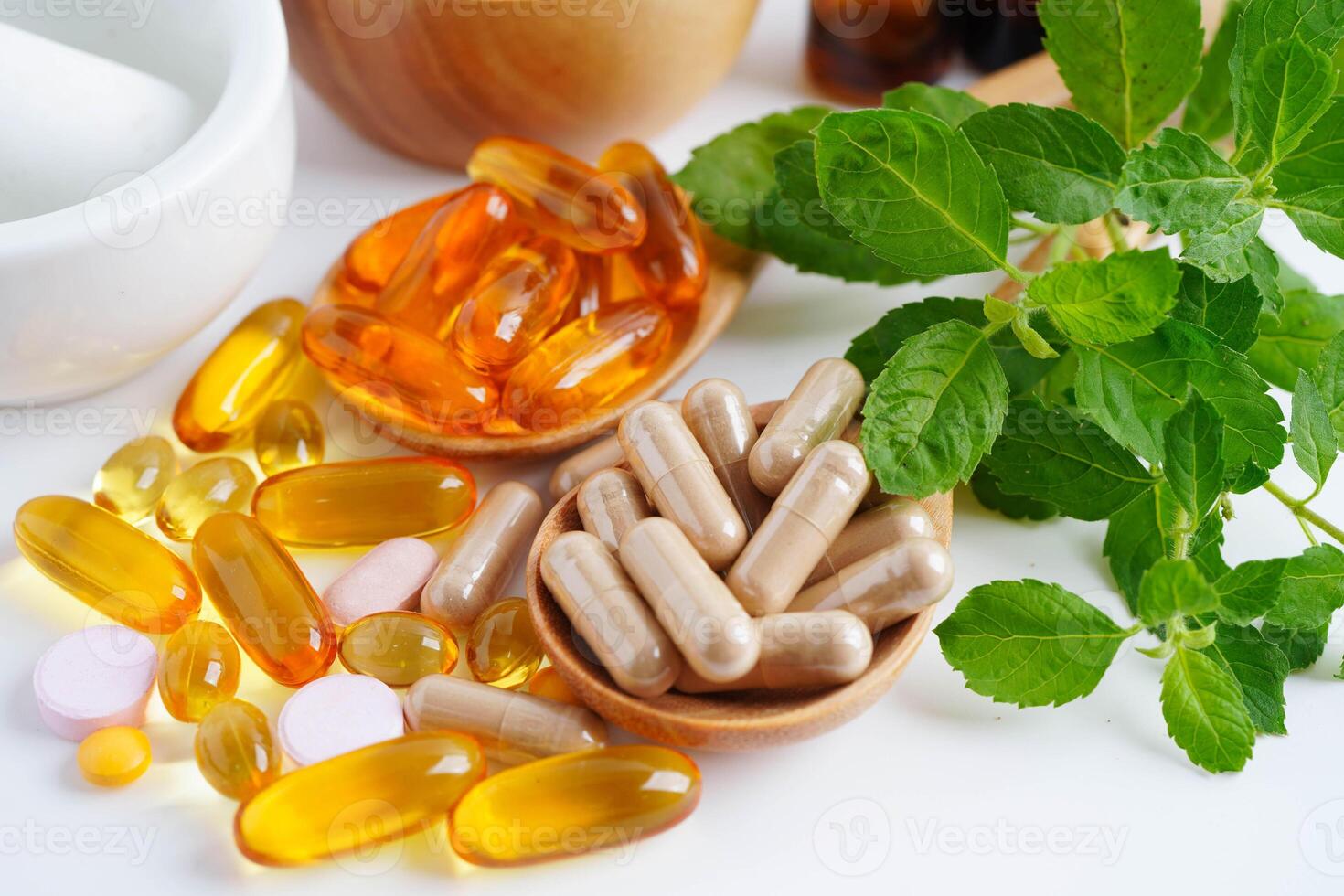 Alternative medicine herbal organic capsule with vitamin E omega 3 fish oil, mineral, drug with herbs leaf natural supplements for healthy photo