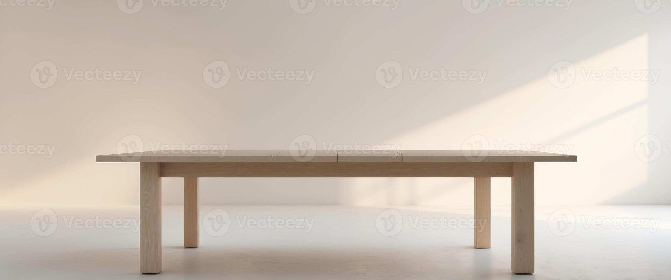 A table in a white room with sunlight coming in through the window photo