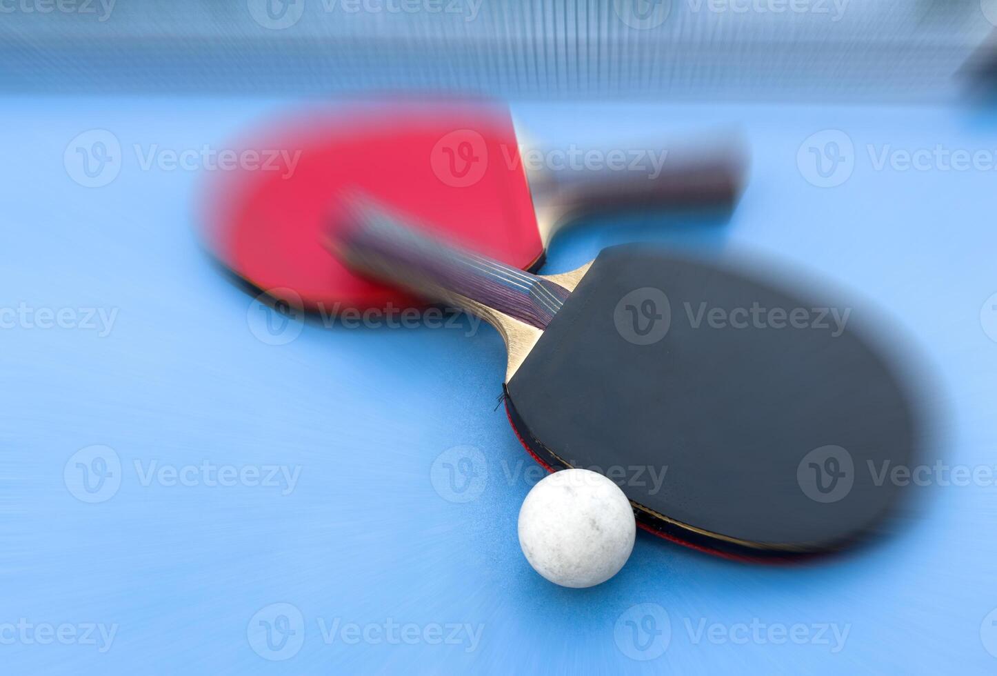 tennis rackets for playing ping pong on blue table, ping pong concept photo