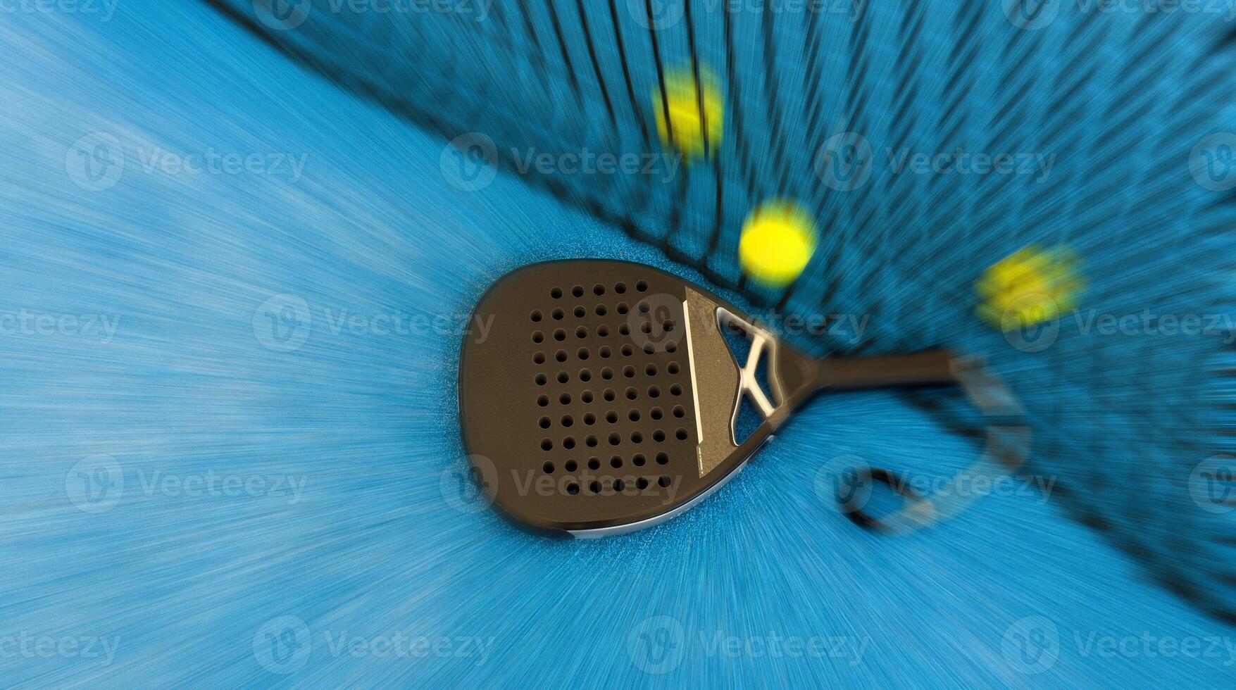 A padel or paddle tennis racket and a bright yellow tennis ball lie on a blue court. photo