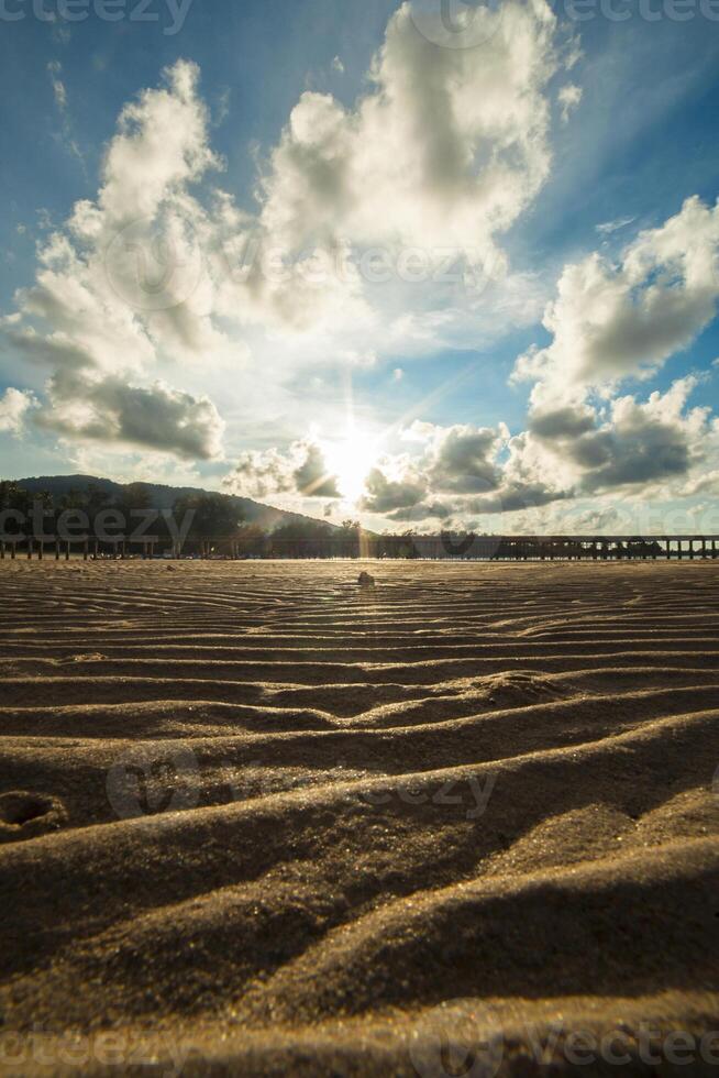 Sand beach texture at sunset photo