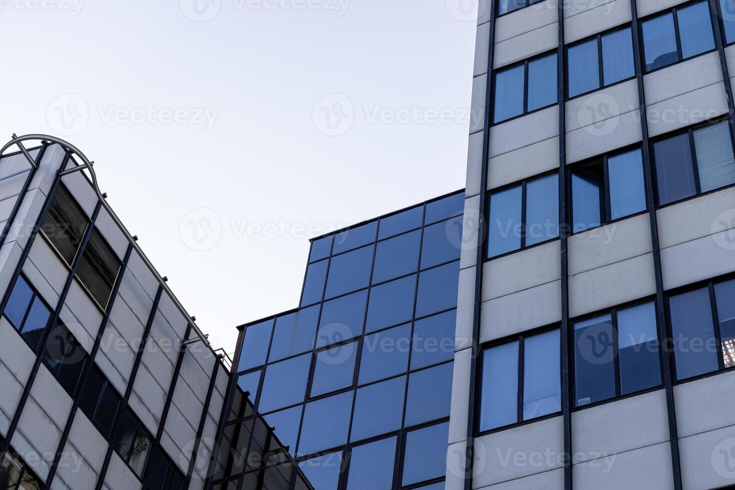 Modern building facade with large glass windows. office background photo
