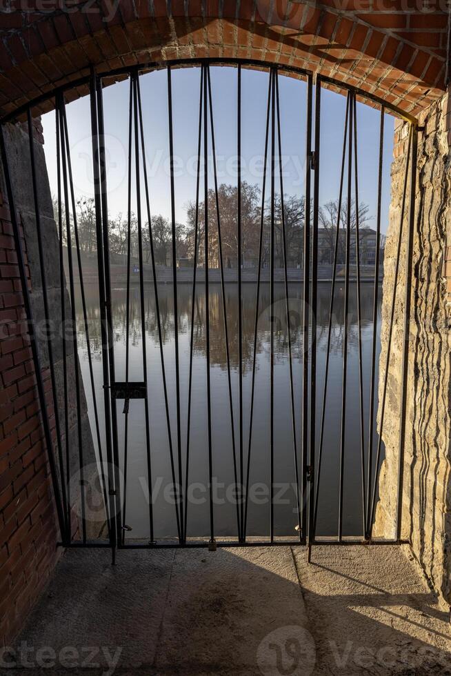 Panorama of Wroclaw, from the side of Ostrow Tumski through the lattice door to the Oder River, Poland. photo