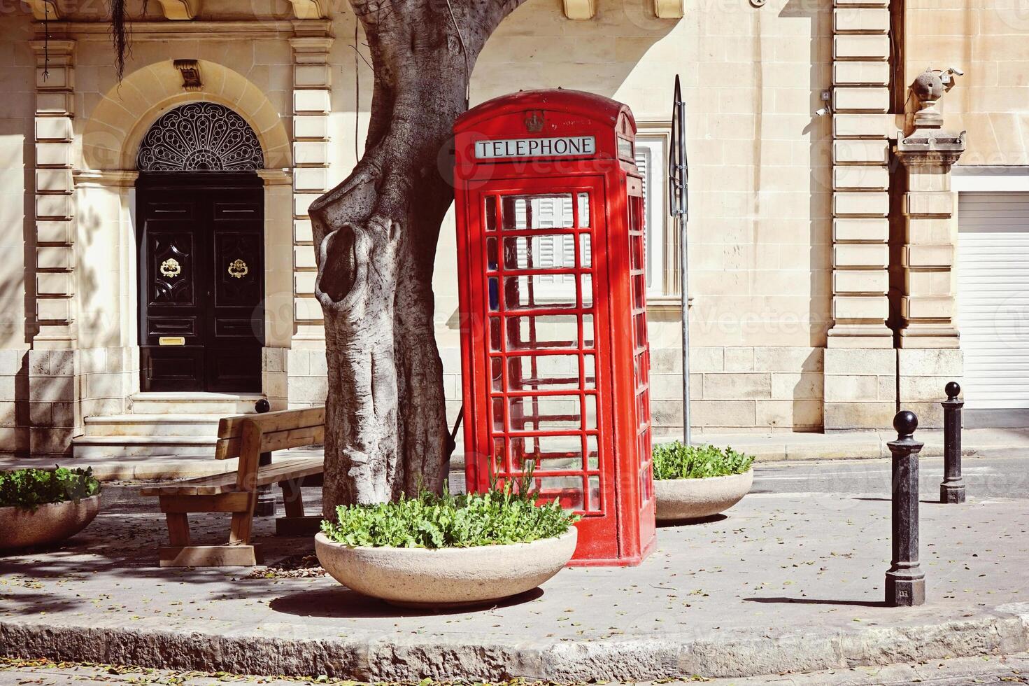 Historic Red Telephone Box in Classic British Style for Public Calls photo