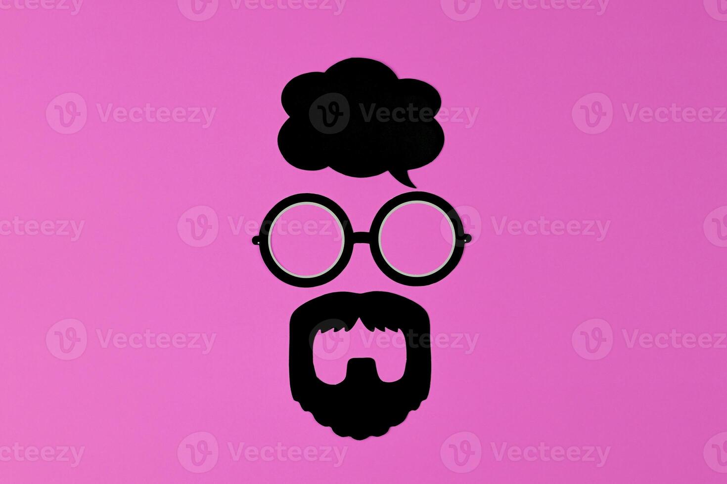 Whimsical glasses and beard silhouette evoke bold persona on pink background photo