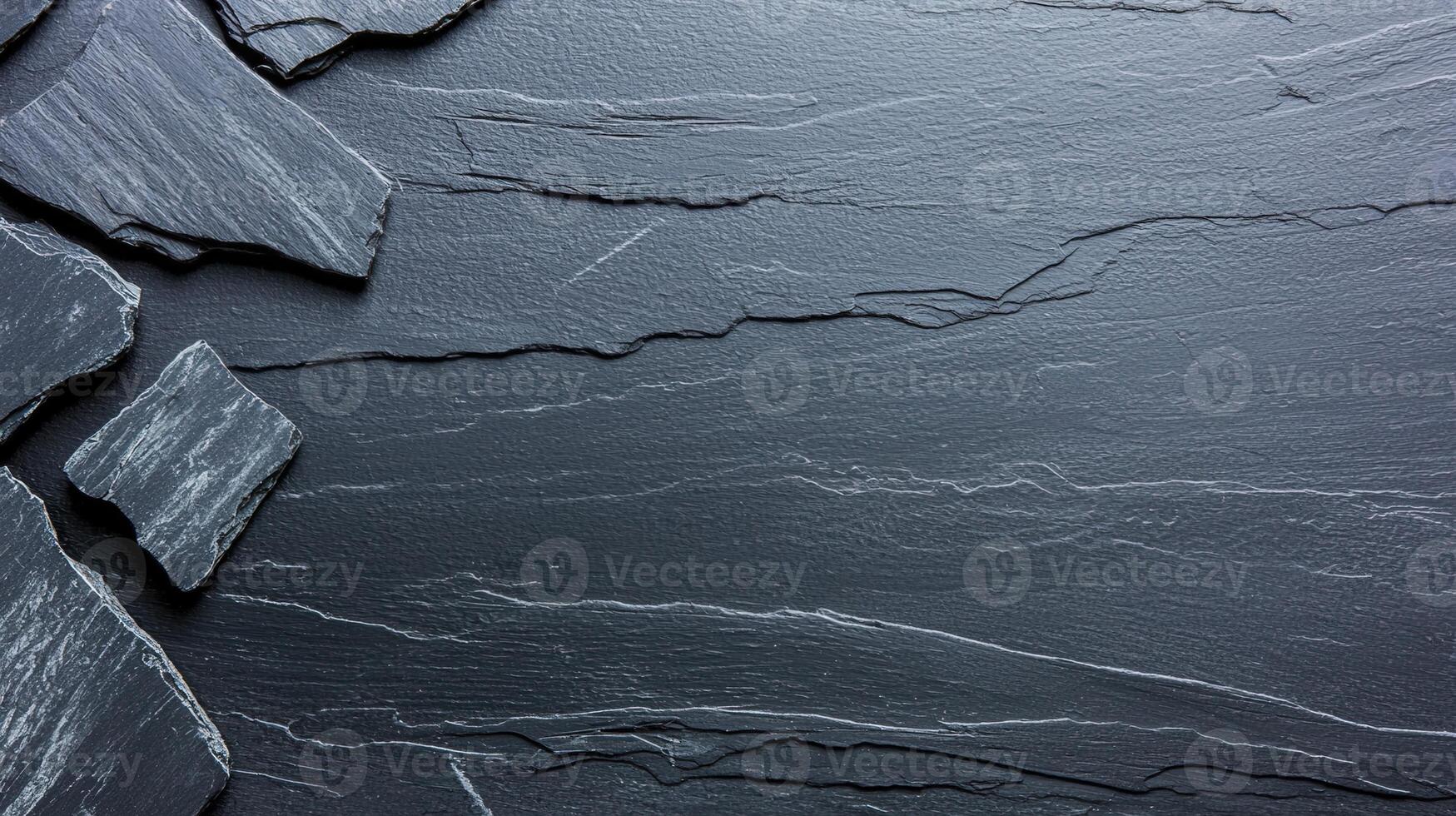 Close-up of natural slate stone texture with unique patterns and rich colors, perfect for background and design use. photo