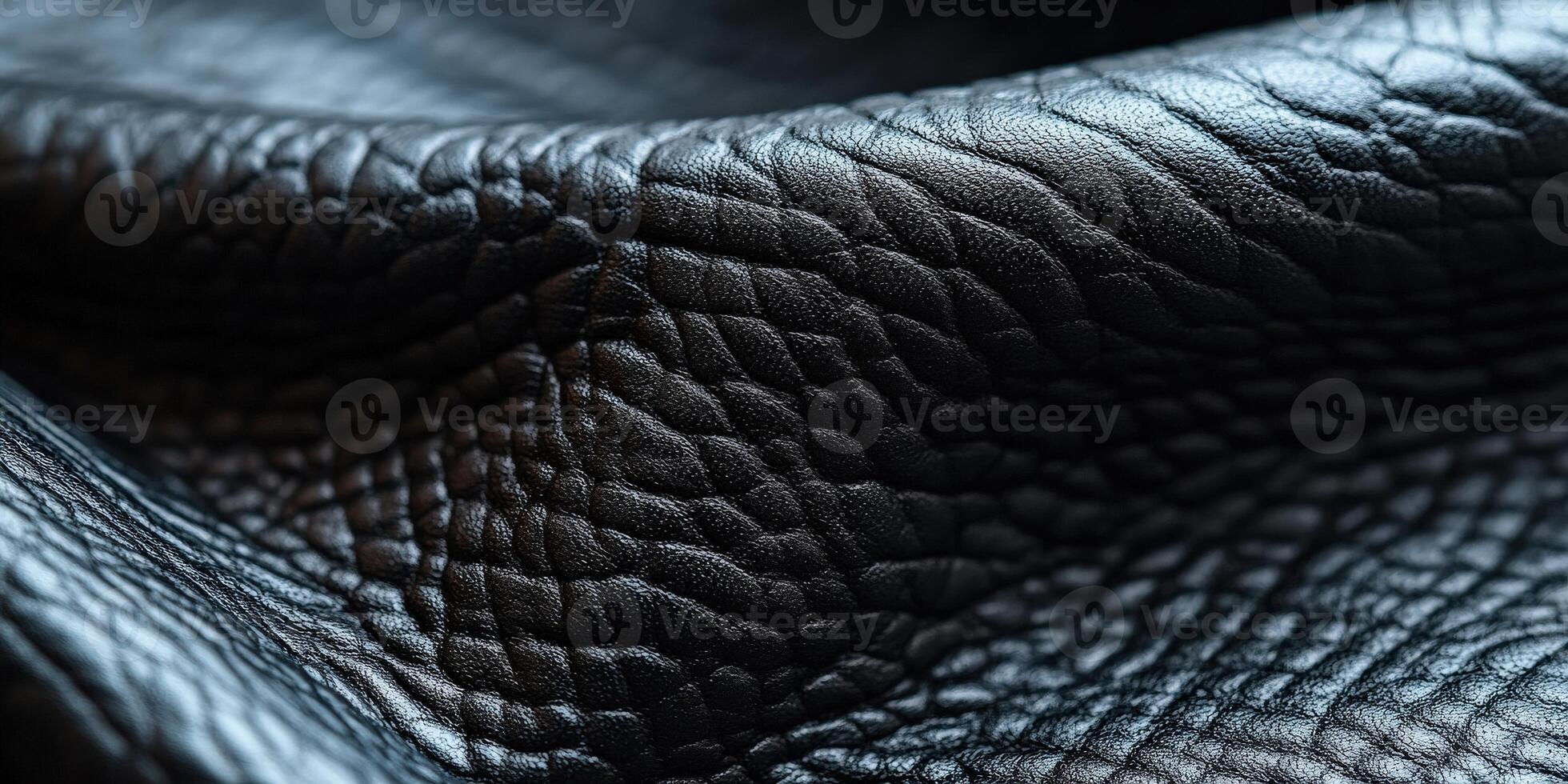 Close-up of textured black leather showcasing its intricate details and luxurious appearance. photo