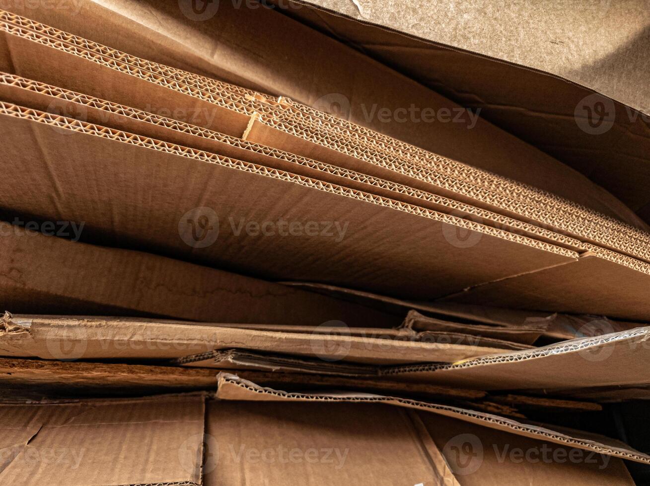 A close-up of corrugated cardboard layers, showcasing the intricate wave texture and structure, suitable for illustrating packaging, recycling, industrial, and material design concepts. photo