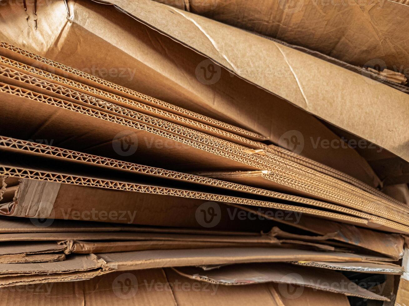 Stacked corrugated cardboard layers in close-up, displaying the detailed wave structure and texture, ideal for packaging, recycling, industry, and material design themes. photo