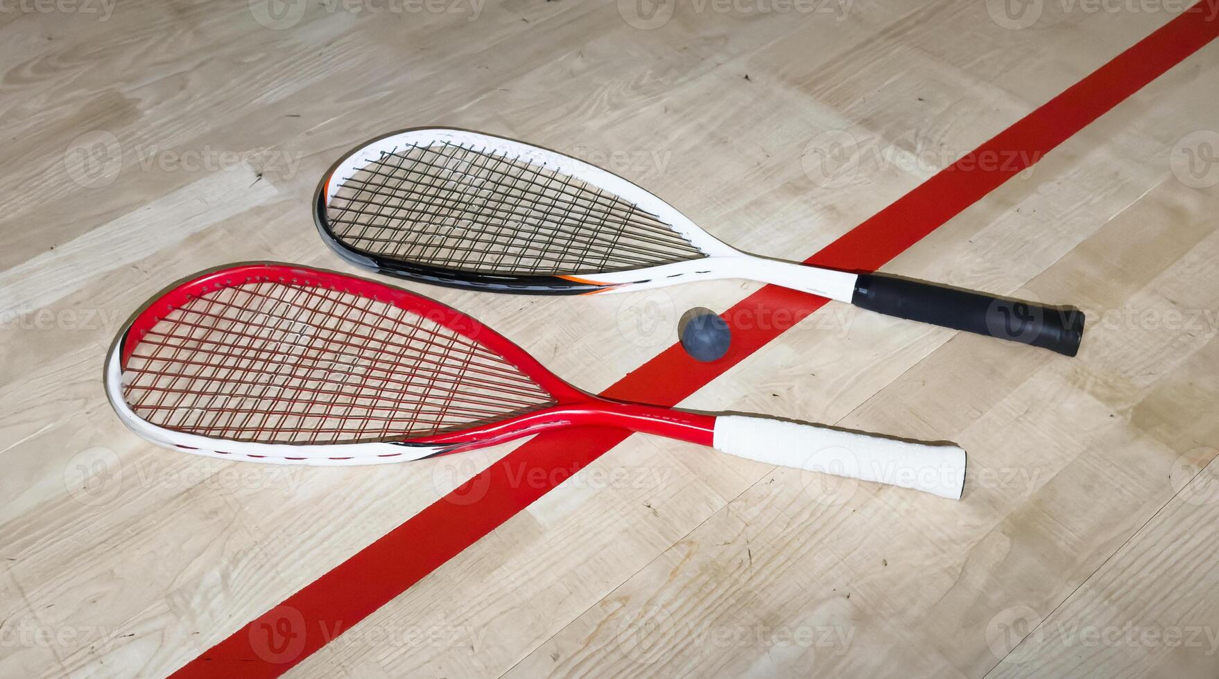 Sports, above and racket on squash court for competition, challenge and training center. Exercise, interior and empty room with top view of wooden floor of gymnasium for games, fitness club and gear photo