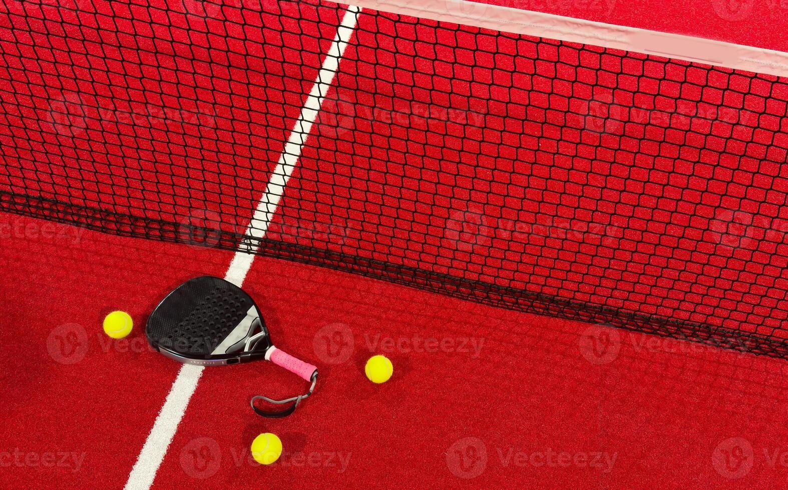 professional paddle tennis racket with natural lighting on red background. Horizontal sport theme poster, greeting cards, headers, website and app photo
