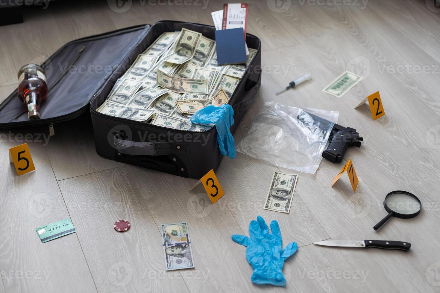 an old black suitcase with an open lid full of one hundred dollar bills. Corruption photo