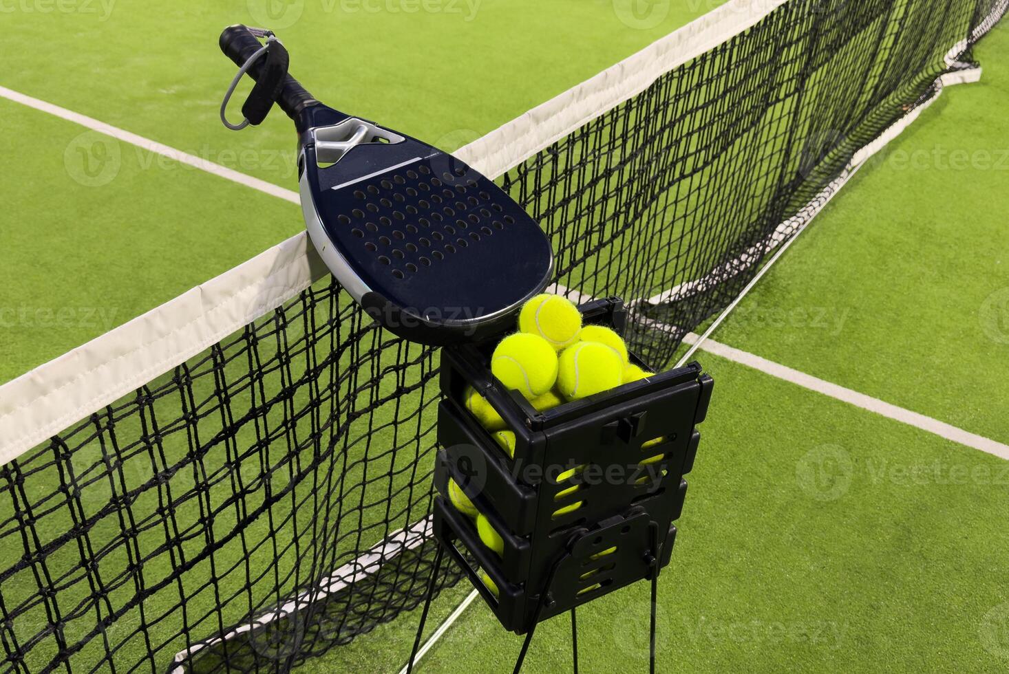 Background of padel racket and ball on artificial grass floor in outdoor court. Top view. photo