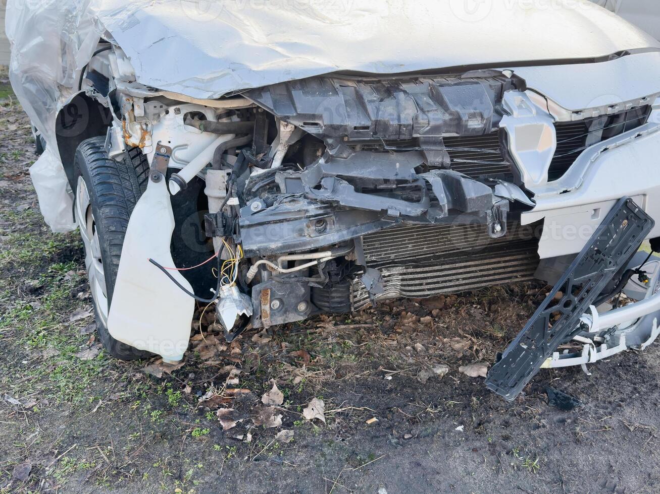 A close-up of the front car, which was demolished by an accident, collided with an electric pole until it was severely damaged. photo