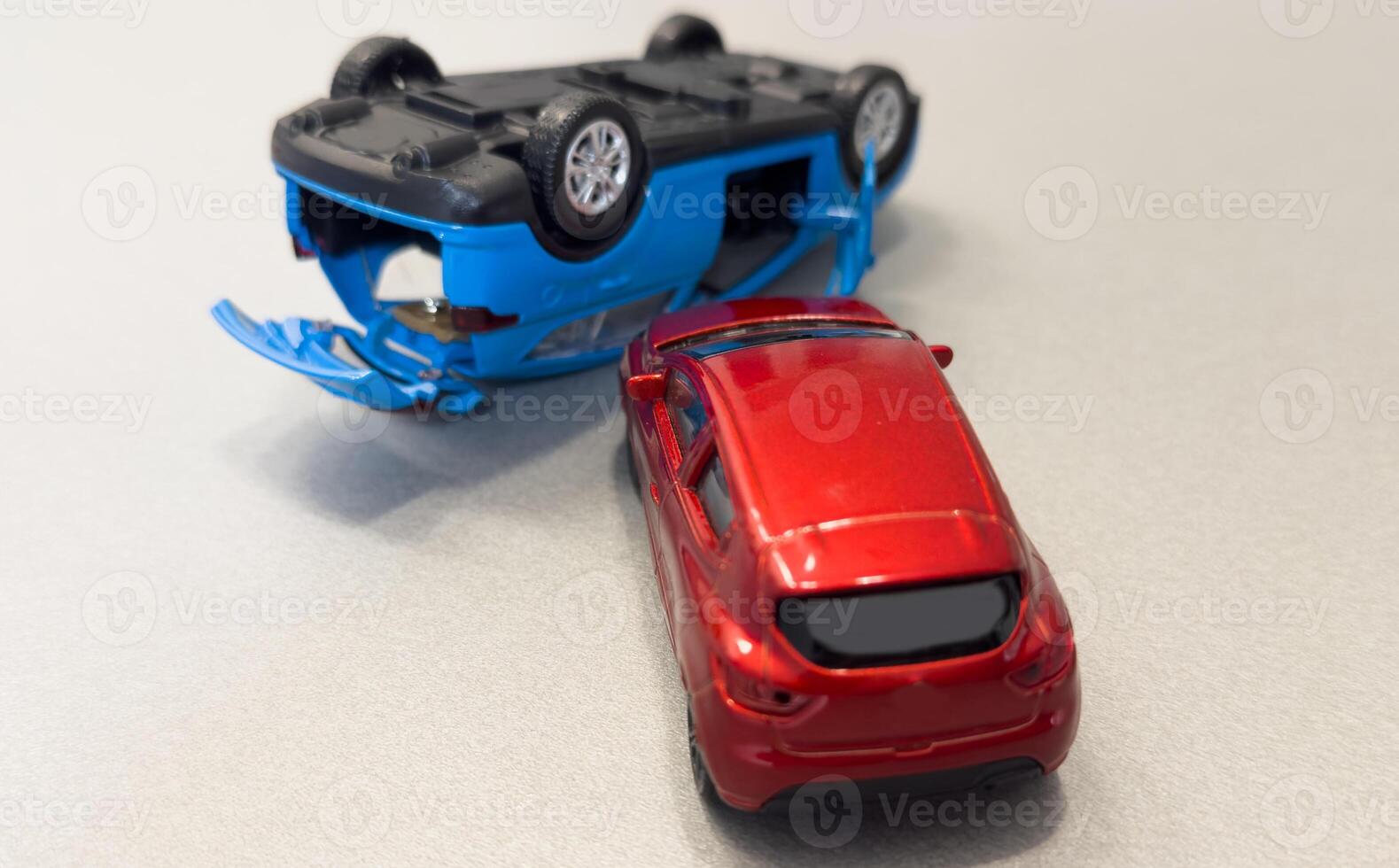 Two mini toy car crash on white background, incident, car traffic accident. Top view photo