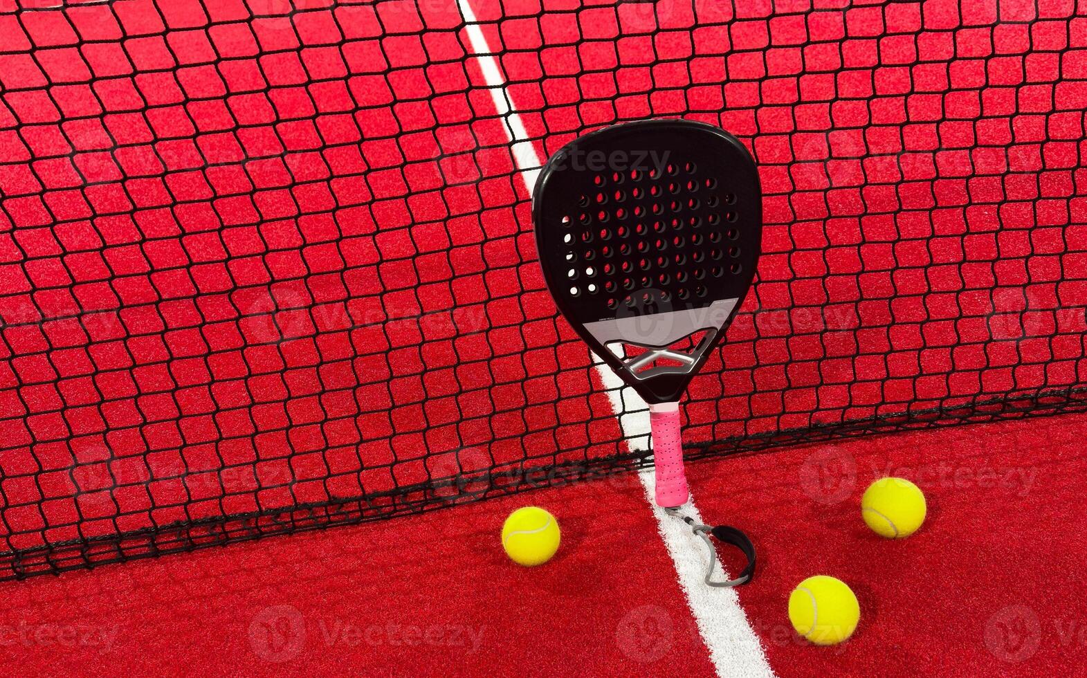 Padel tennis racket. Background with copy space. Sport court and balls. photo