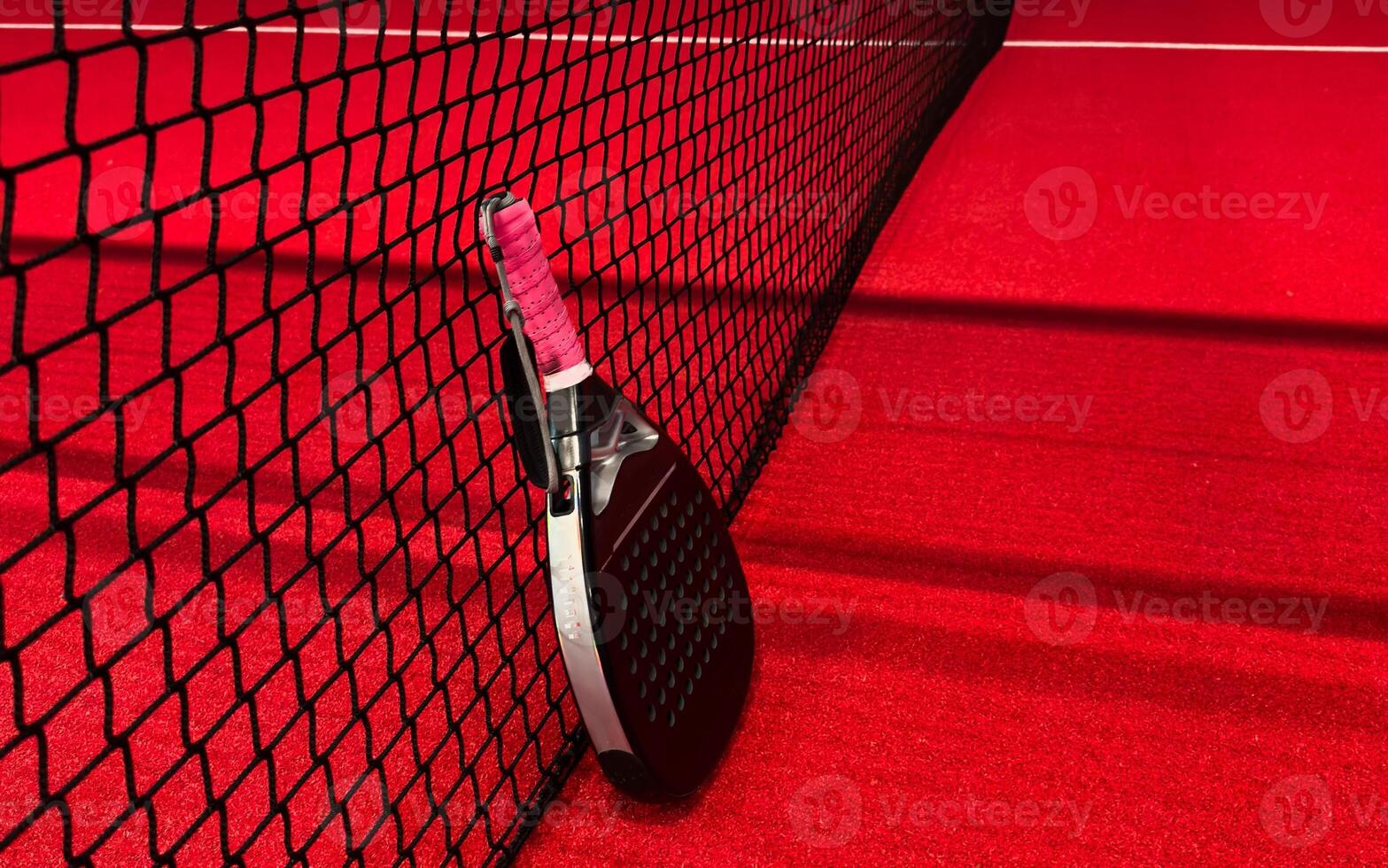 Padel tennis racket. Background with copy space. Sport court and balls. photo