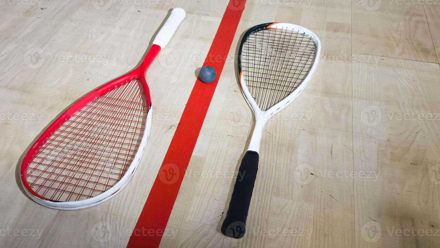 Sports, above and racket on squash court for competition, challenge and training center. Exercise, interior and empty room with top view of wooden floor of gymnasium for games, fitness club and gear photo