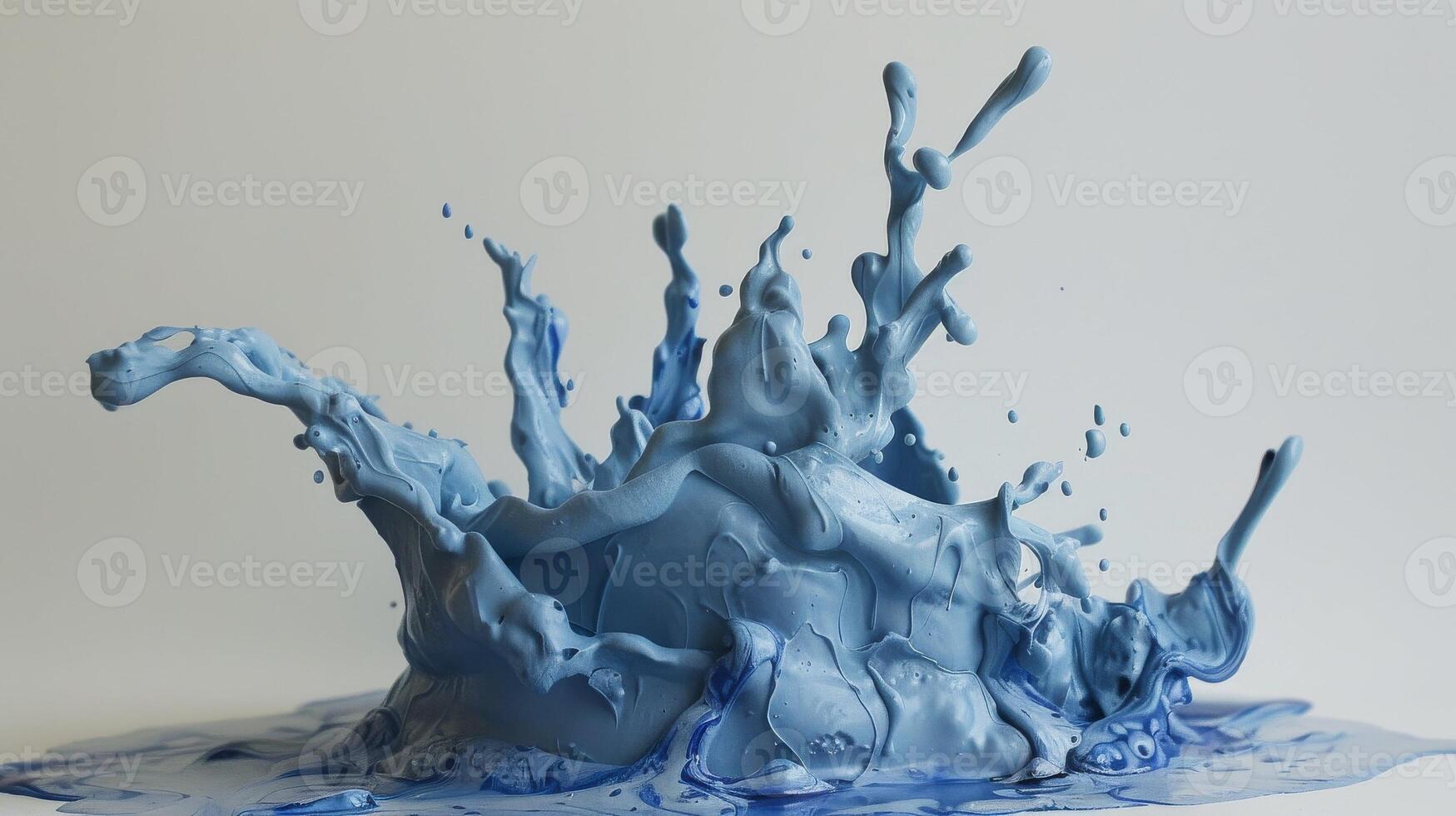 A blue liquid splashing on a white surface photo