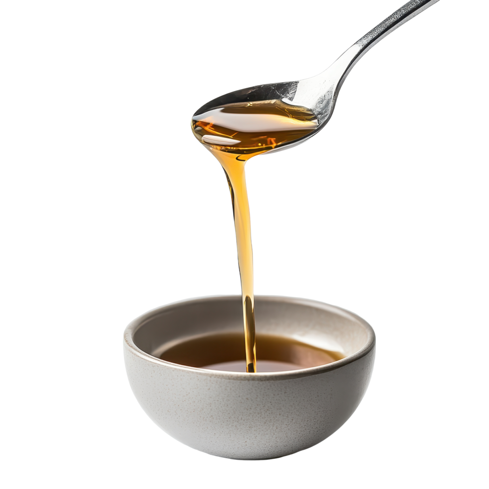 Liquid is flowing from a spoon into a white bowl against a plain background, spoon with liquid pouring out it in a bowl, Transparent background png