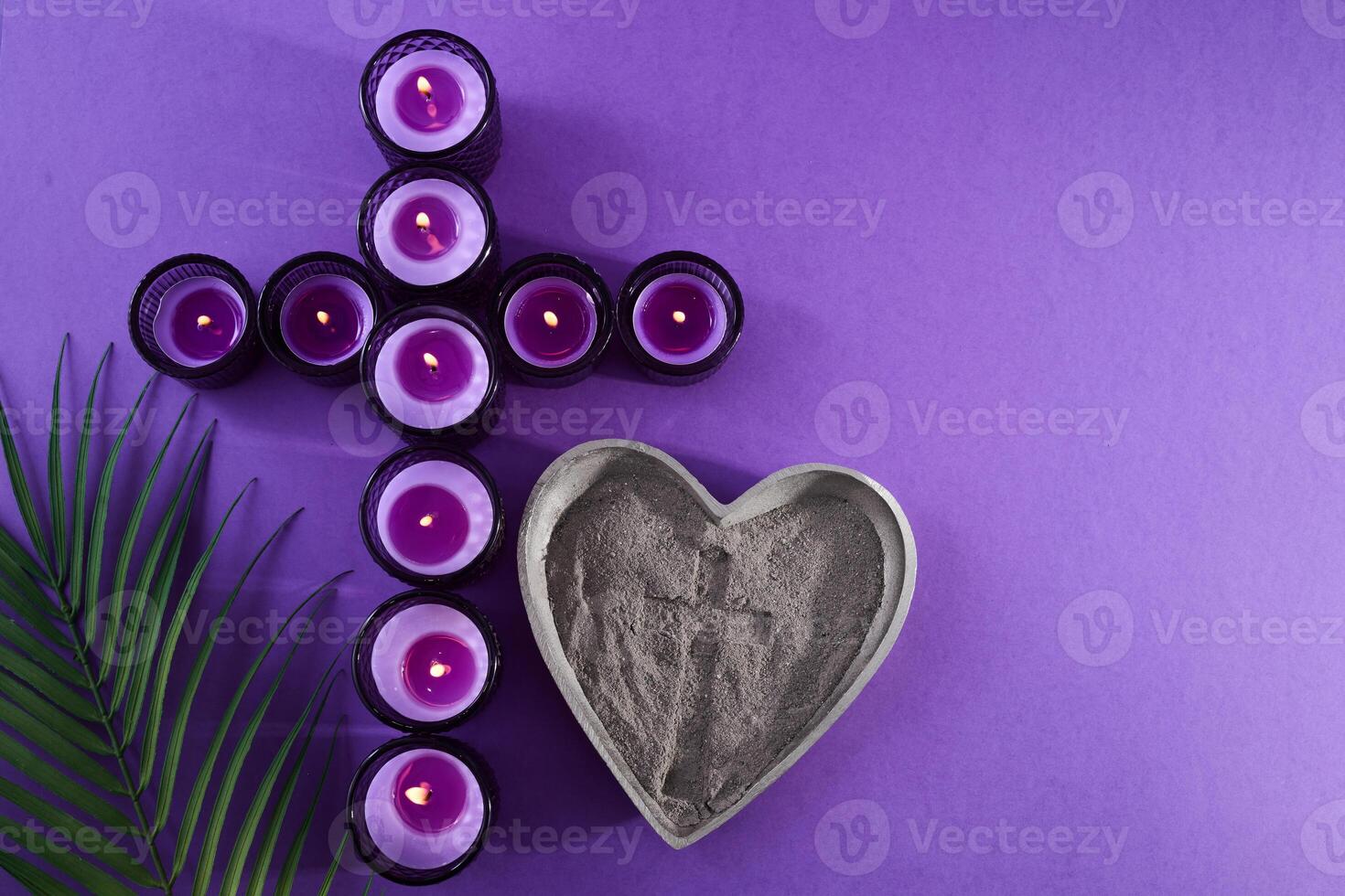 Lenten Symbols. Candles and ashes on purple background photo