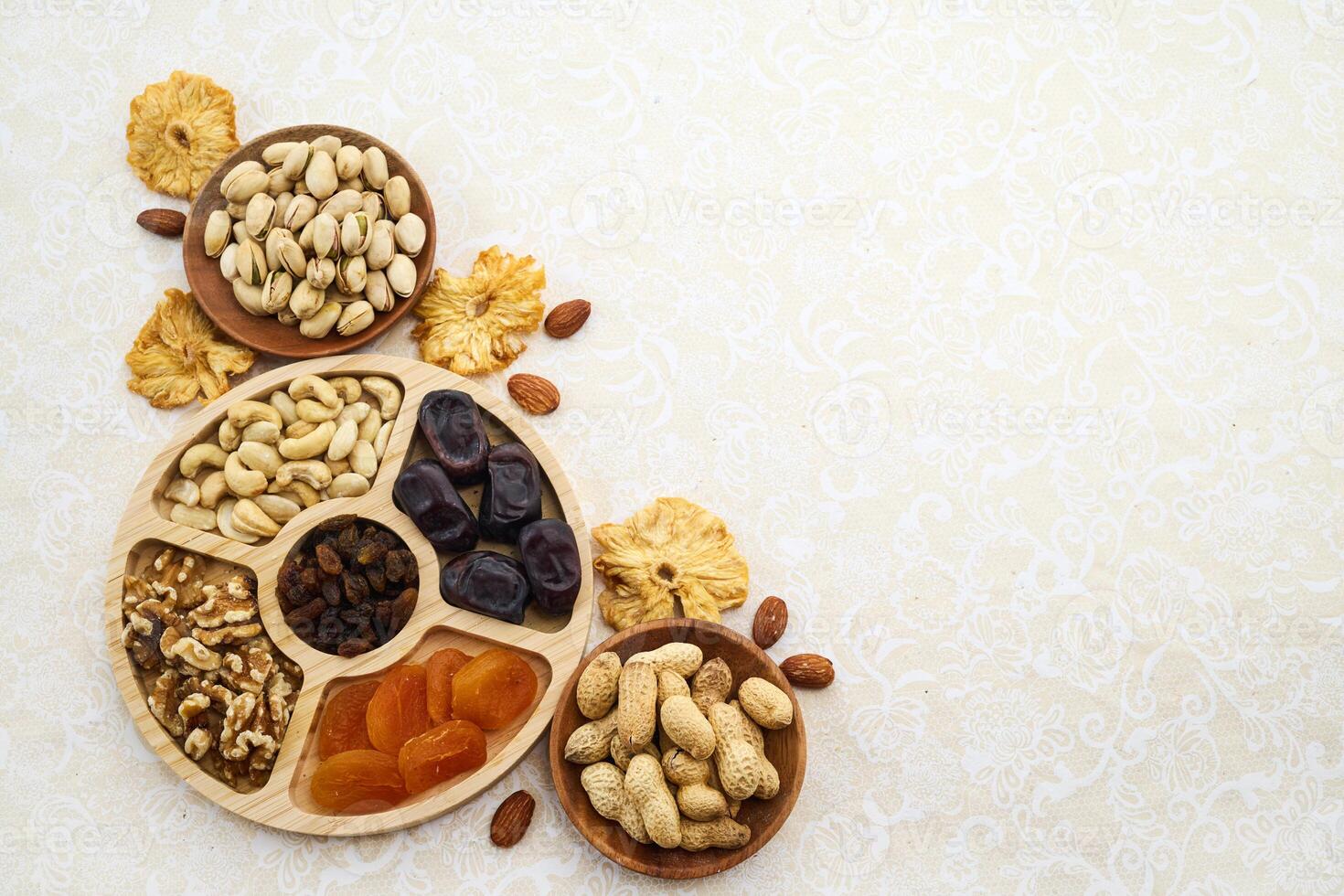 Concept of the Jewish holiday Tu Bishvat. Heart-shaped arrangement of dried fruits and nuts photo