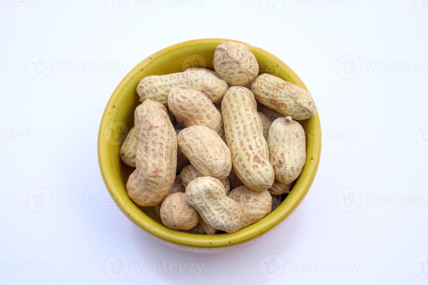 Peanuts, Groundnuts, Goobers in a bowl, Top View, Isolated, White Background photo