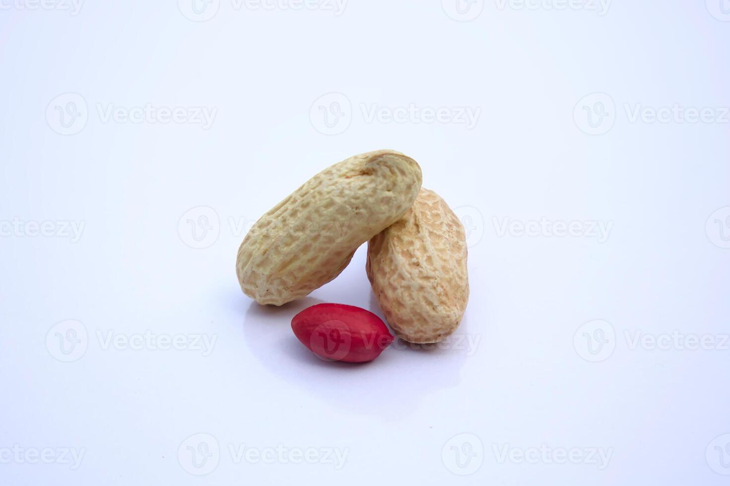 Whole and Shelled Peanuts, Groundnut, Goober Close-Up, Isolated on White Background photo