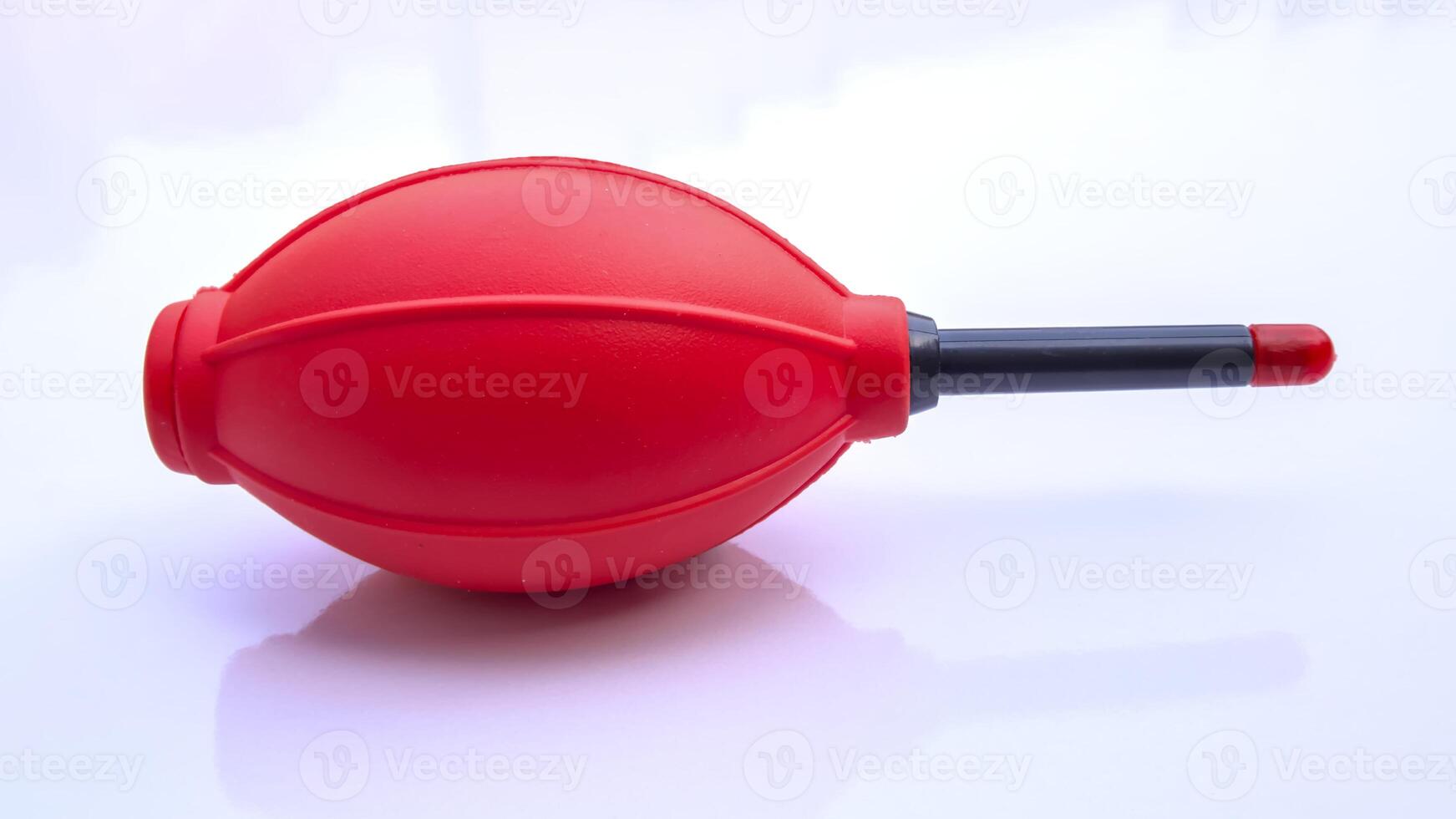 Lens Cleaning Pump, Red Rubber Air Blower, Dust Cleaner, Isolated on White Background photo
